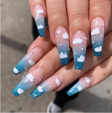 Blue ombre false nails with cloud design, Wearing Nails.