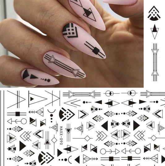 Black butterfly nail stickers with geometric designs on stiletto nails.