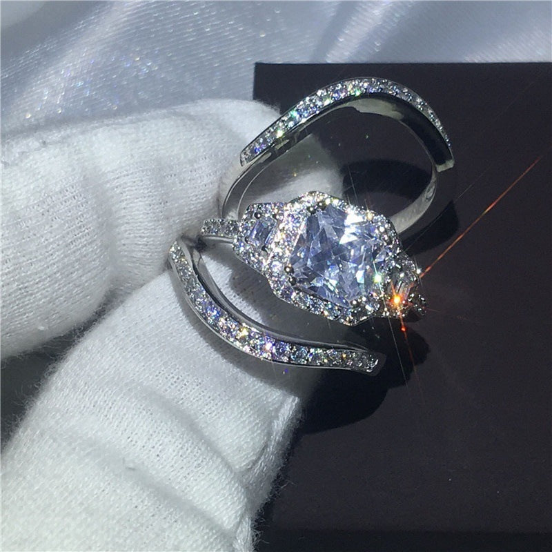 Fashion Explosion Set zircon ring with full diamond design on white fabric background.