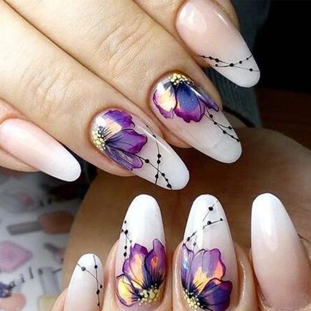 Nail art with butterfly flower water transfer decals.