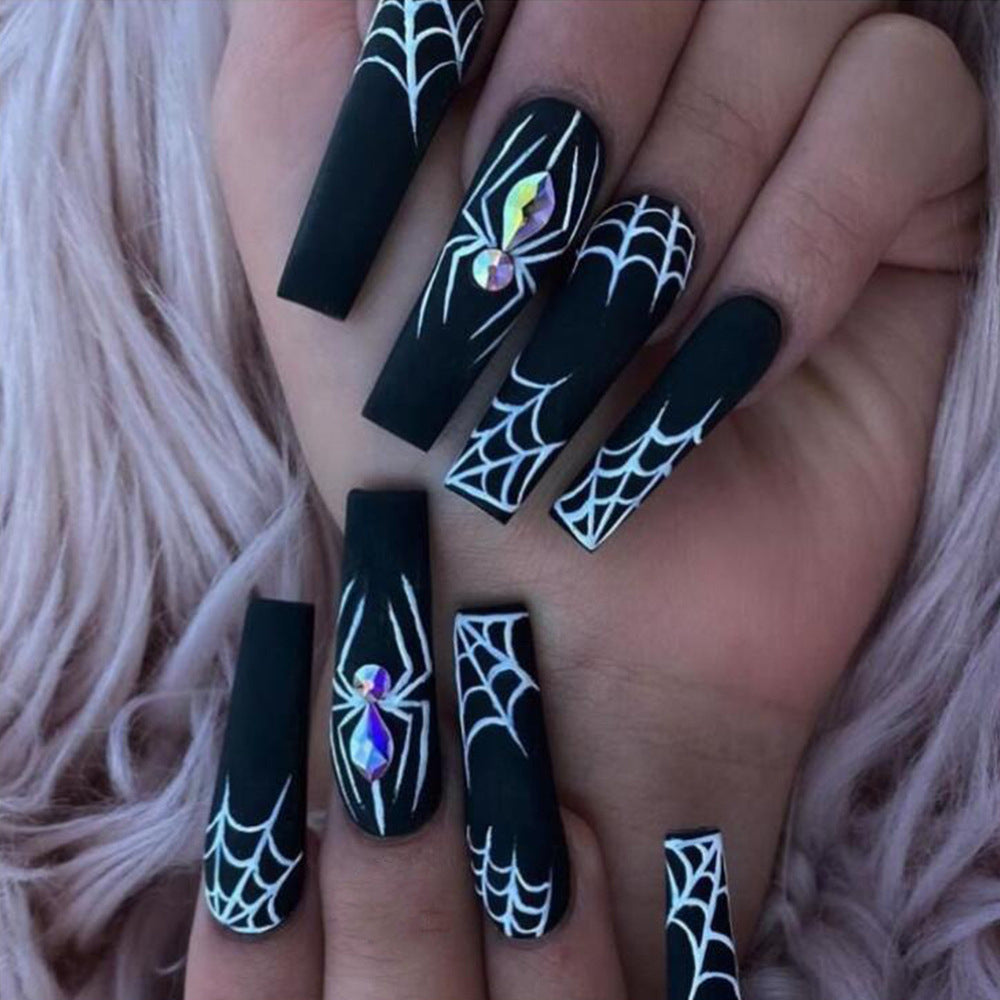 Dark Spider Halloween nail armor with cartoon spider web design.