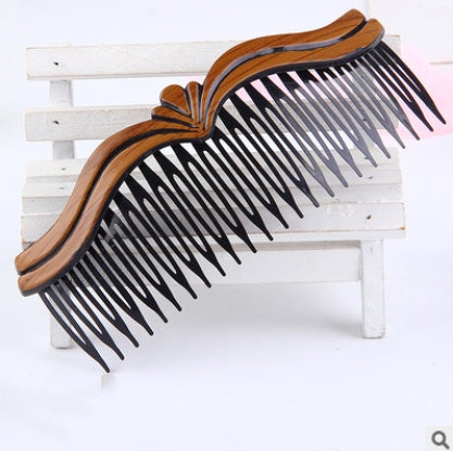 Fashion retro hair comb with wave styling, made of plastic and resin.