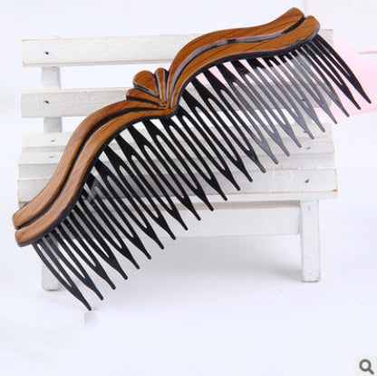 Fashion retro hair comb with wave styling, made of plastic and resin.