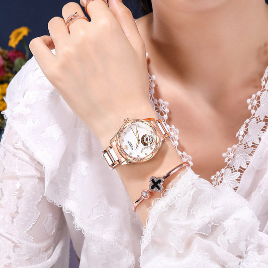 Women's luxury designer mechanical watch with ceramic, stainless steel strap, and luminous features.