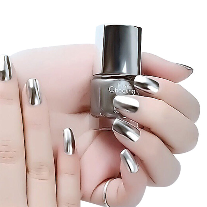 Mirror nail polish bottle with polished nails.