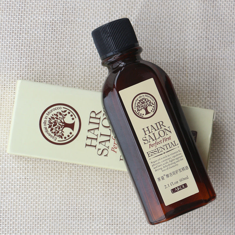 Hair Salon Protect Hair Essential Oil bottle on textured background, moisturizing and nourishing formula for smooth, glossy hair.