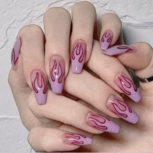 Soft purple false nails with a pink flame design, featuring a wearable set from the Wearing Nails collection.