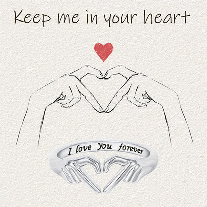 Romantic Heart Hand Hug fashion ring with engraved "I love you forever" message.