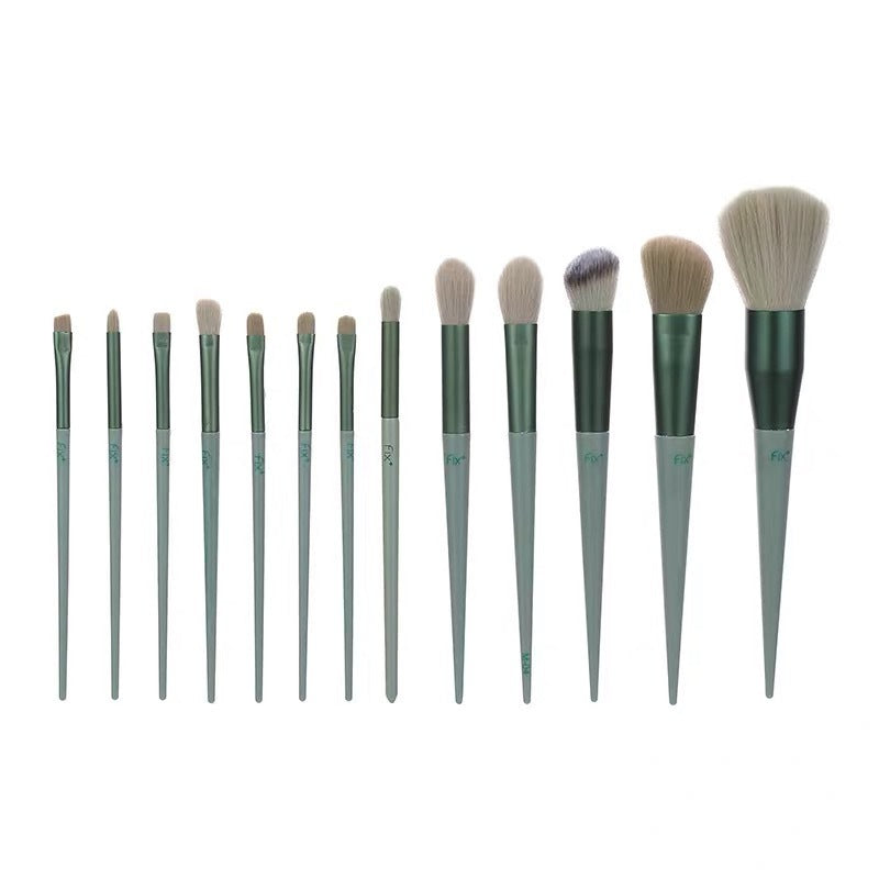 13-piece makeup brush set with various brushes including powder, foundation, and eyeshadow; green handles.