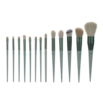 13-piece makeup brush set with various brushes including powder, foundation, and eyeshadow; green handles.