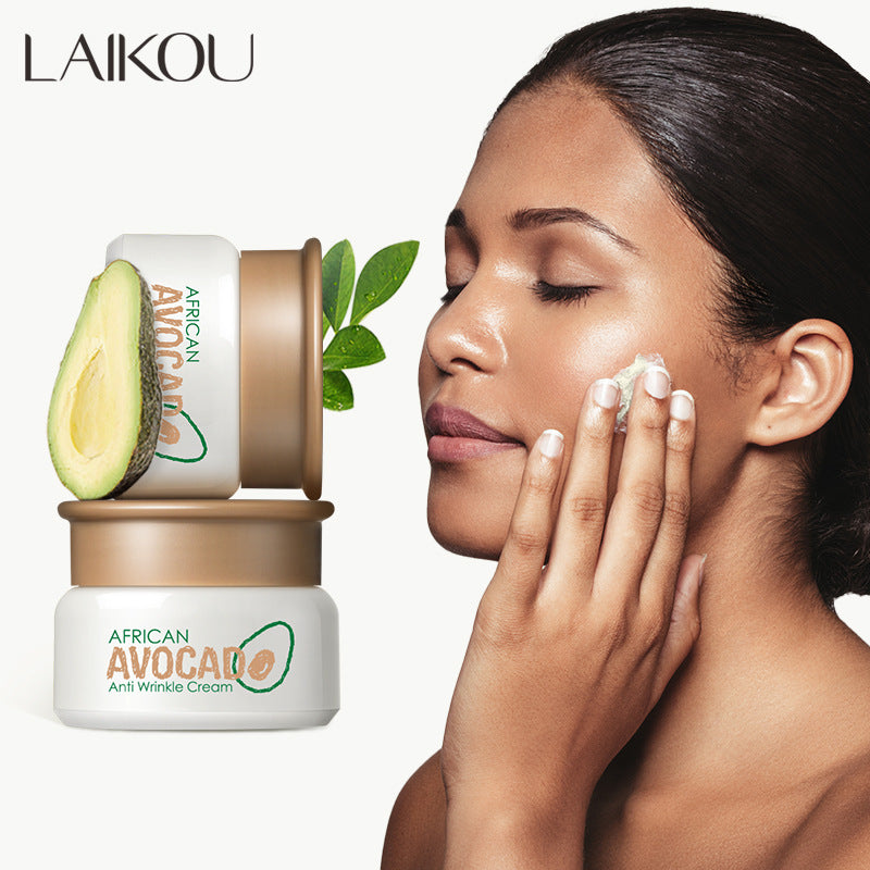 Avocado antifreeze cream jar with a woman applying cream to her face.