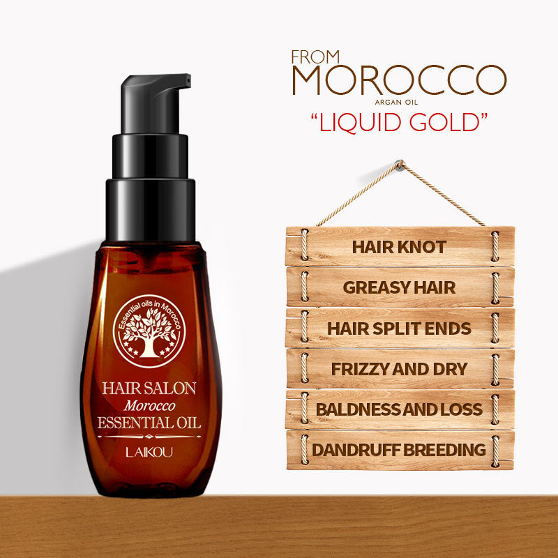 Moroccan hair oil bottle labeled as essential oil, promoting hair health benefits like reducing frizz, split ends, and greasiness.