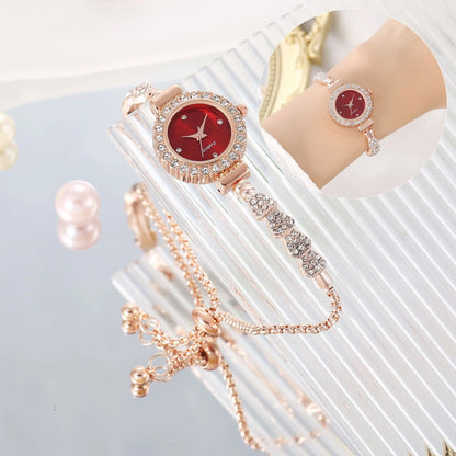 Fashion luxury women's watch with a gold fine strap and red dial.