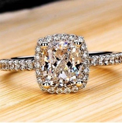 Elegant white gold engagement ring with diamond detailing for women.