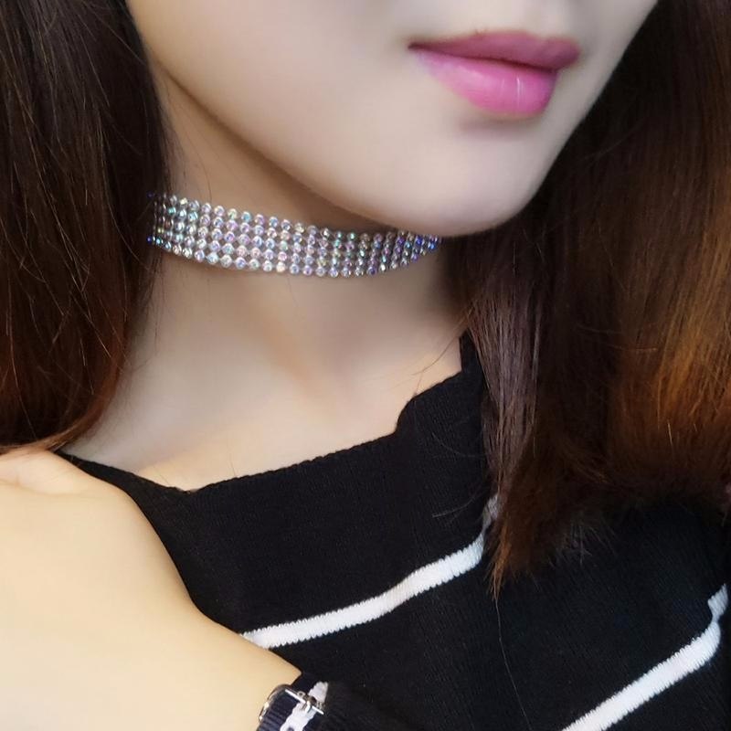 Fashion women full crystal rhinestone choker necklace in multicolor, worn by a woman with dark hair and pink lipstick.