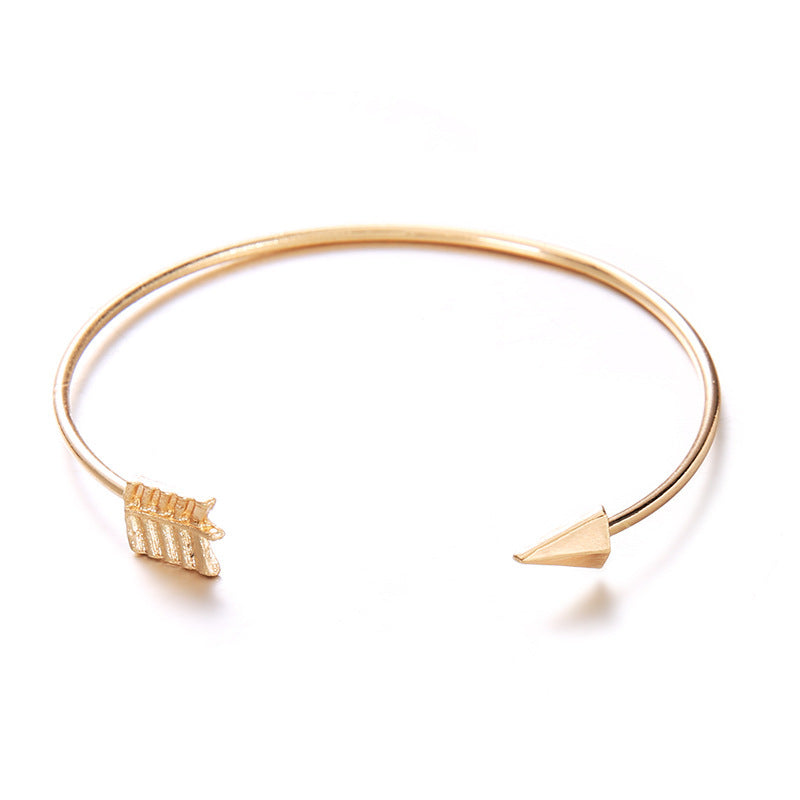 Women's Vintage Cuff Arrow Knotted Bracelet in gold alloy with unique design.