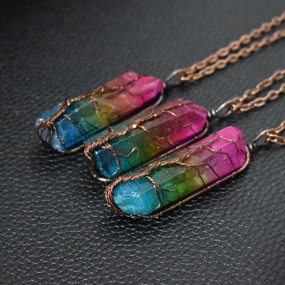 Rainbow stone crystal pillar pendant necklace with tree of life design.