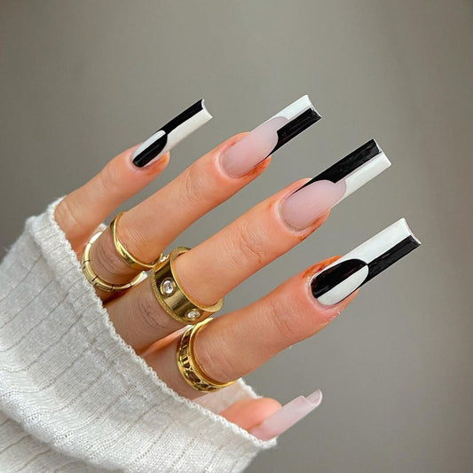 Simple black and white matching long nails with removable tips.