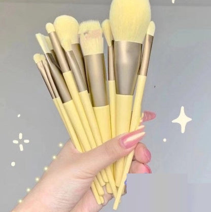 13Pcs makeup brush set with yellow handles and soft bristles, including foundation, powder, and eyeshadow brushes.