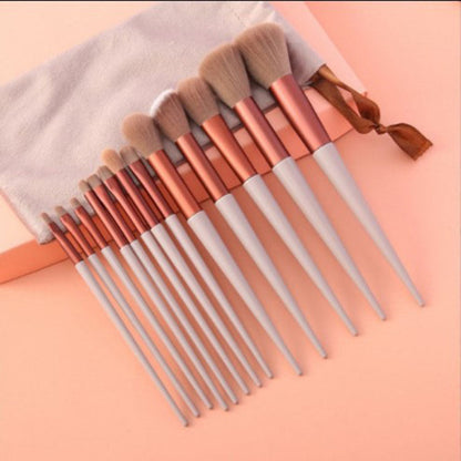 13-piece makeup brush set with soft bristles and durable handles, displayed in a cloth bag.