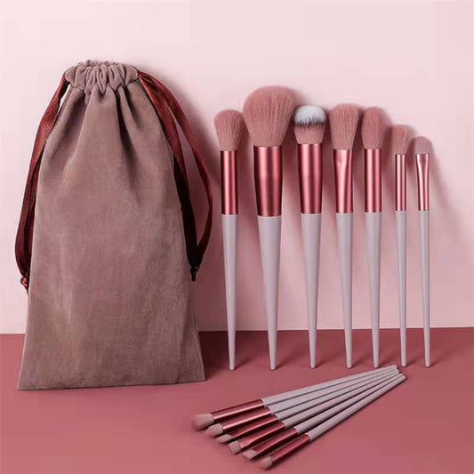 13Pcs Makeup Brush Set with pink brushes and matching cloth bag.