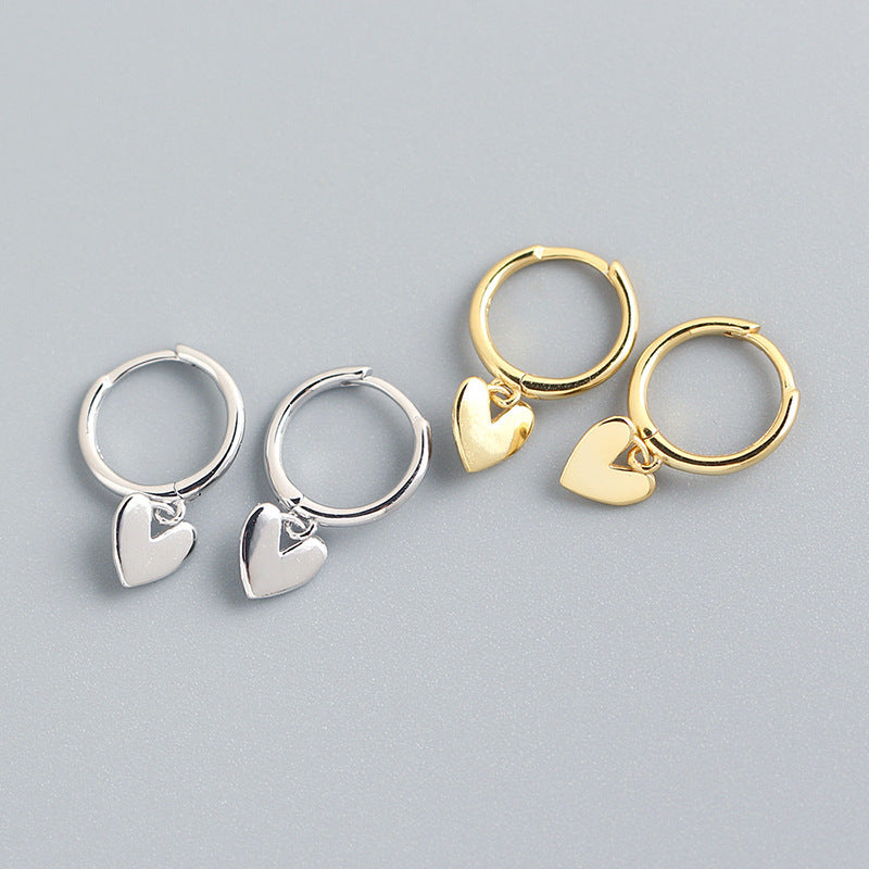 Love Heart Earrings in white gold and gold, heart-shaped copper design.